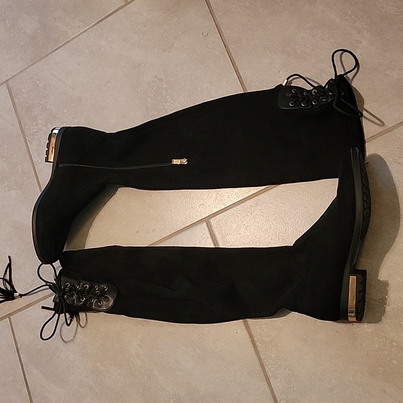 Knee-length boots with gold heel accent, side zipper, and adjustable back laces. - Picture 1 of 14